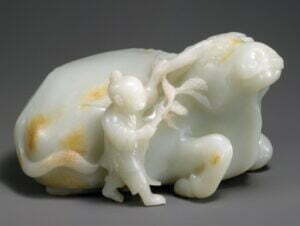 A white and russet jade boy and buffalo, Qing dynasty, 18th century, 18.5cm long. Metropolitan Museum, Gift of Heber Bishop, 1902
