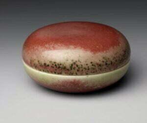 A peach bloom seal paste box and cover, Kangxi mark and period, 7.1cm diameter. Metropolitan Museum, Gift of Edwin C. Vogel, 1966